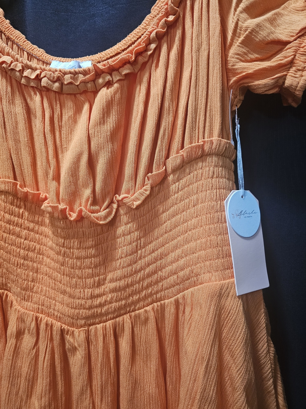 Blashe Orange Ruffle Smocked Romper